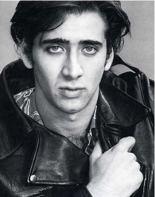 a black and white photo of young Nicolas Cage