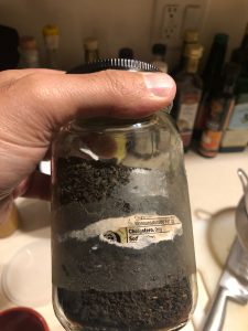 An unlabeled glass jar of tea