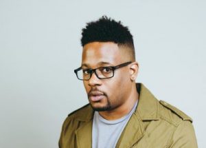 Mike Eagle today in a green jacket and grey shirt.