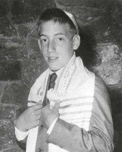 Teen Alan Zweibel in a black and white photo wearing a yamaka