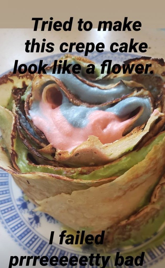 A crepe cake comprising many colors and formed in a round with the caption 