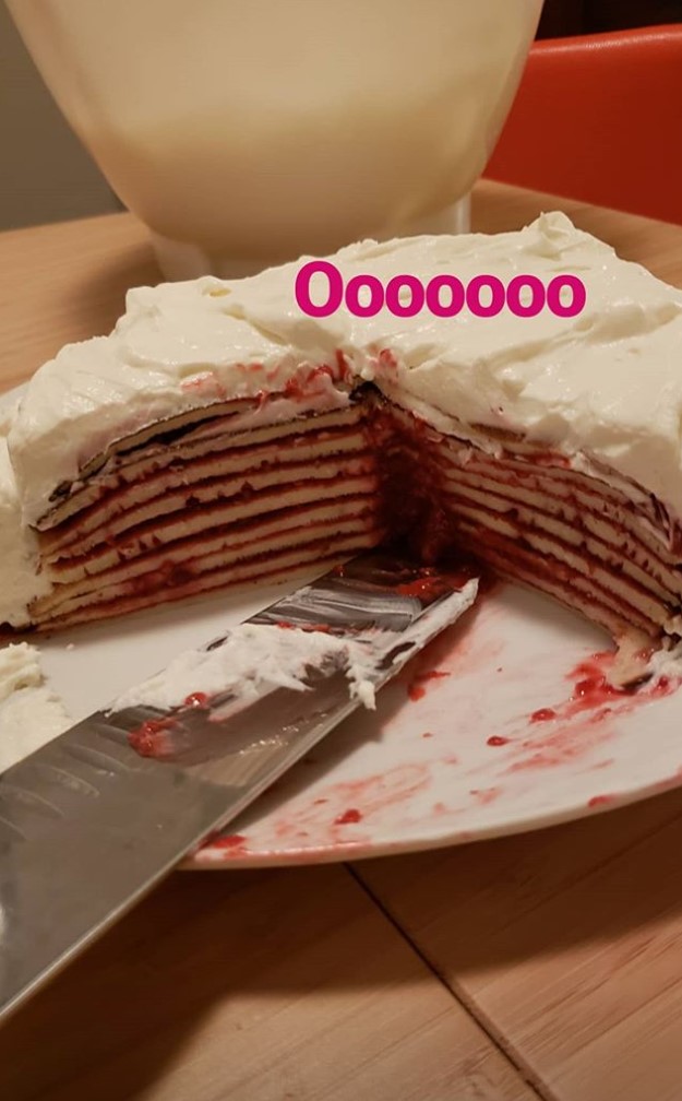 a crepe cake with a few slices cut out of it and the caption 