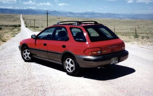 The back angle of a red Subaru Impreza wagon