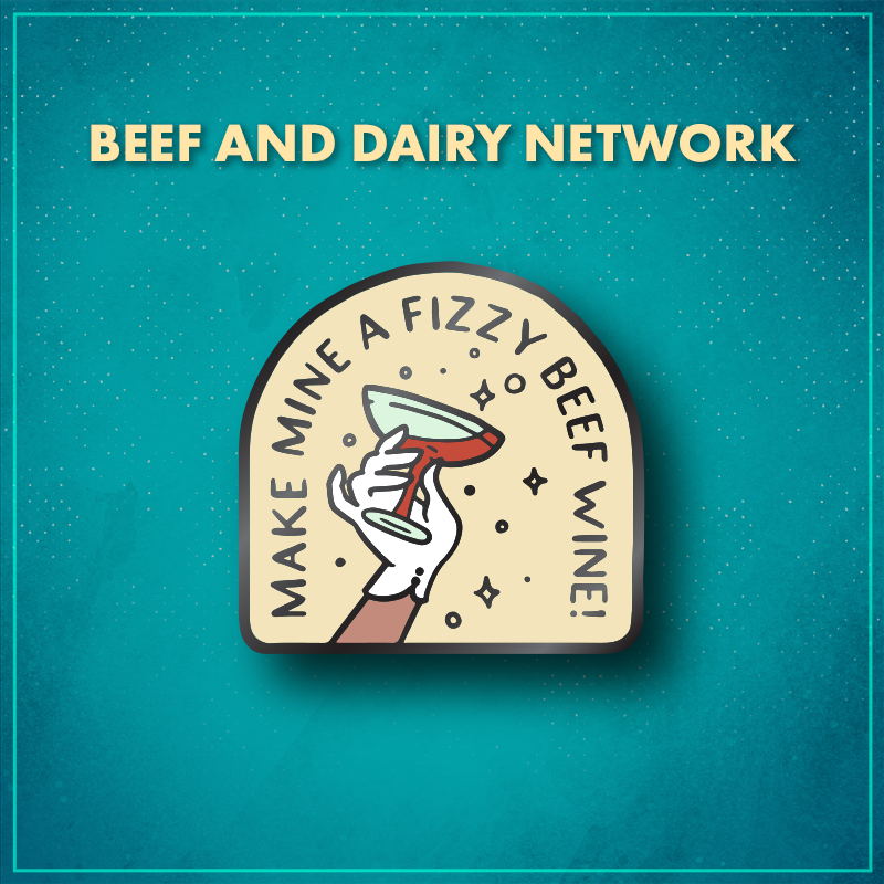 The Beef and Dairy Network. An arched shape with the words "Make mine a fizzy beef wine!" along the arch, with a white-gloved hand holding a champagne saucer of red liquid in the center.