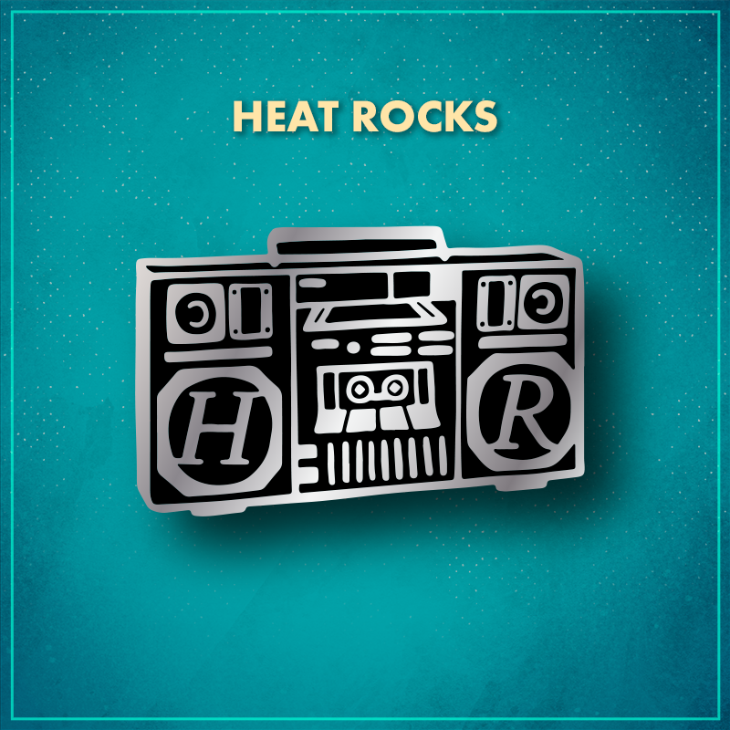 Heat Rocks. A black ‘90s-style boom box with silver features. The speaker circle on the left encircles an "H" and the one on the right includes an "R."