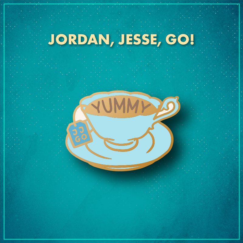 Jordan, Jesse, Go! A fancy light blue tea cup on a light blue saucer, filled with tea. The tea has the word "yummy" written on it, and a blue tea bag hangs down the left side with the letters "JJGO" on it.