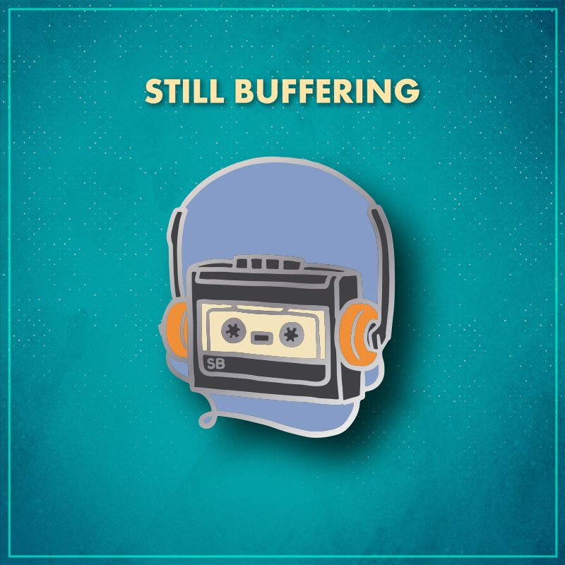 Still Buffering. A grey cassette player on a periwinkle background with the letters "SB" in the lower left corner. The player is wearing headphones with orange padding on the ears and houses an off-white cassette.