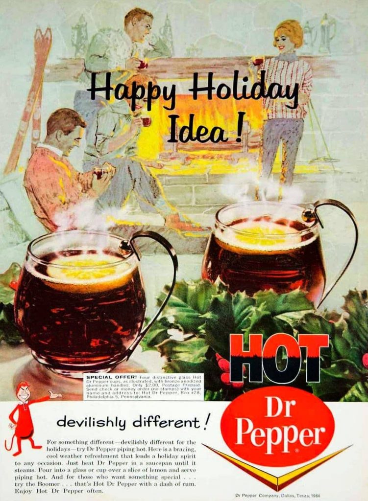 An ad for Dr Pepper showing a family in front of a fireplace, two large mugs of hot Dr. Pepper with lemon slices, and text on the bottom showing a special offer. Beneath that is a devil cartoon with the text next to him, 