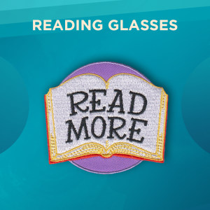 Reading Glasses. An open book with large text that says “Read More” in front of a round patch. The background of the patch is light purple.