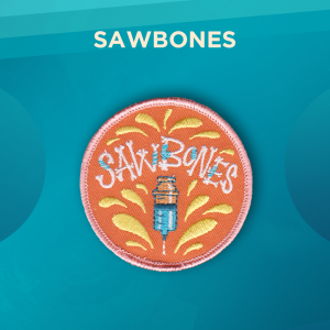 Sawbones: A Martial Tour of Misguided Medicine. A round orange patch. A syringe and the word Sawbones (spelled with a font that looks like bones) are in the middle of many yellow drops.