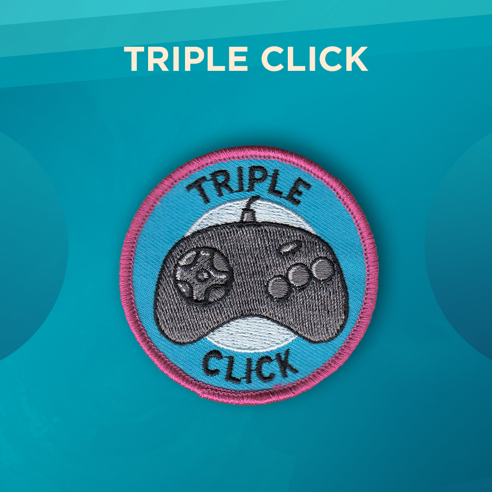 Triple Click. A Sega Genesis video game controller on a blue background with a lighter blue circle in the center. The top of the patch says Triple and the bottom says Click. There’s a pink border around the round patch.