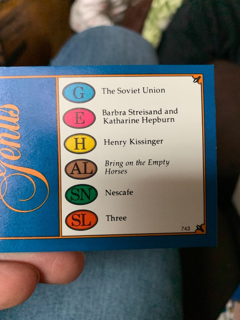 The other side of the Trivial Pursuit card with the following answers corresponding to the other photo: G. The Soviet Union / E. Barbra Streisand and Katherine Hepburn / H. Henry Kissinger / AL. BRING ON THE EMPTY HORSES / SN. Nescafe / SL. Three