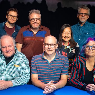 The group that appeared in this episode (clockwise: Jed Whedon, J. Keith van Straaten, Helen Hong, Mark Evanier, Mim Pond, Rob Corddry, Jeffery Bell