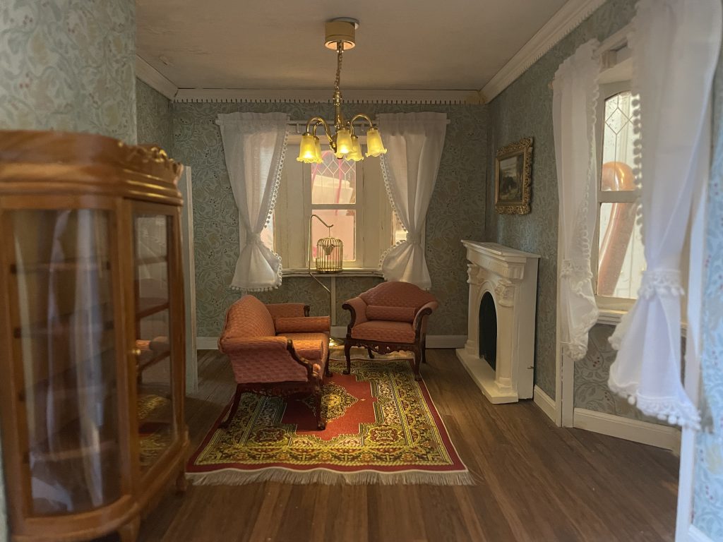 The interior of a dollhouse sitting room