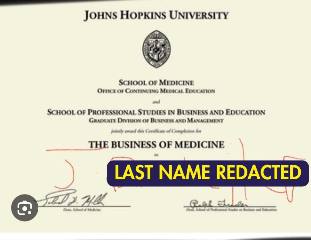 A screenshot of a Johns Hopkins University with someone's name scrawled on it in red, written in the iphone photo editor. 