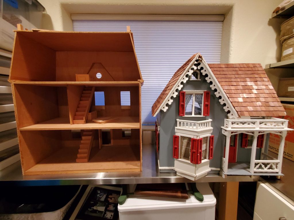 Two dollhouses side by side. The left is unfinished, the right is finished.