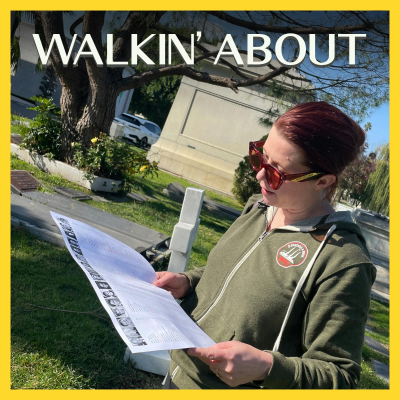 Eva Anderson reads an informational pamphlet in Hollywood Forever Cemetery.