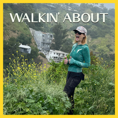 Janet Varney smiling in front of the Bronson Caves.