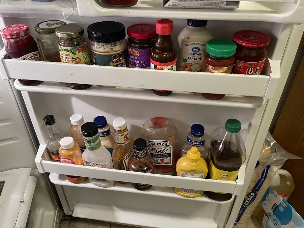 sauces and condiments in refrigerator door shelves