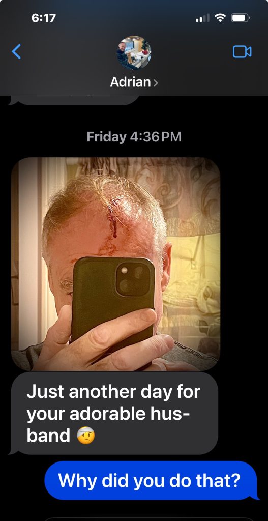 A screenshot of text message conversation with a photo of a bloody head injury