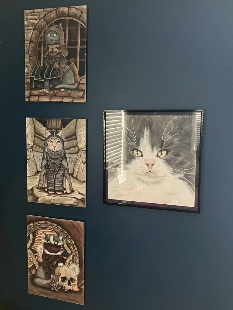 framed pet art on a wall